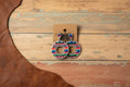 Serape circle drop earrings with multicolor embroidered circles and gold-toned centers