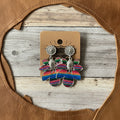 Serape drop earrings with silver floral studs and multicolor fan tassels