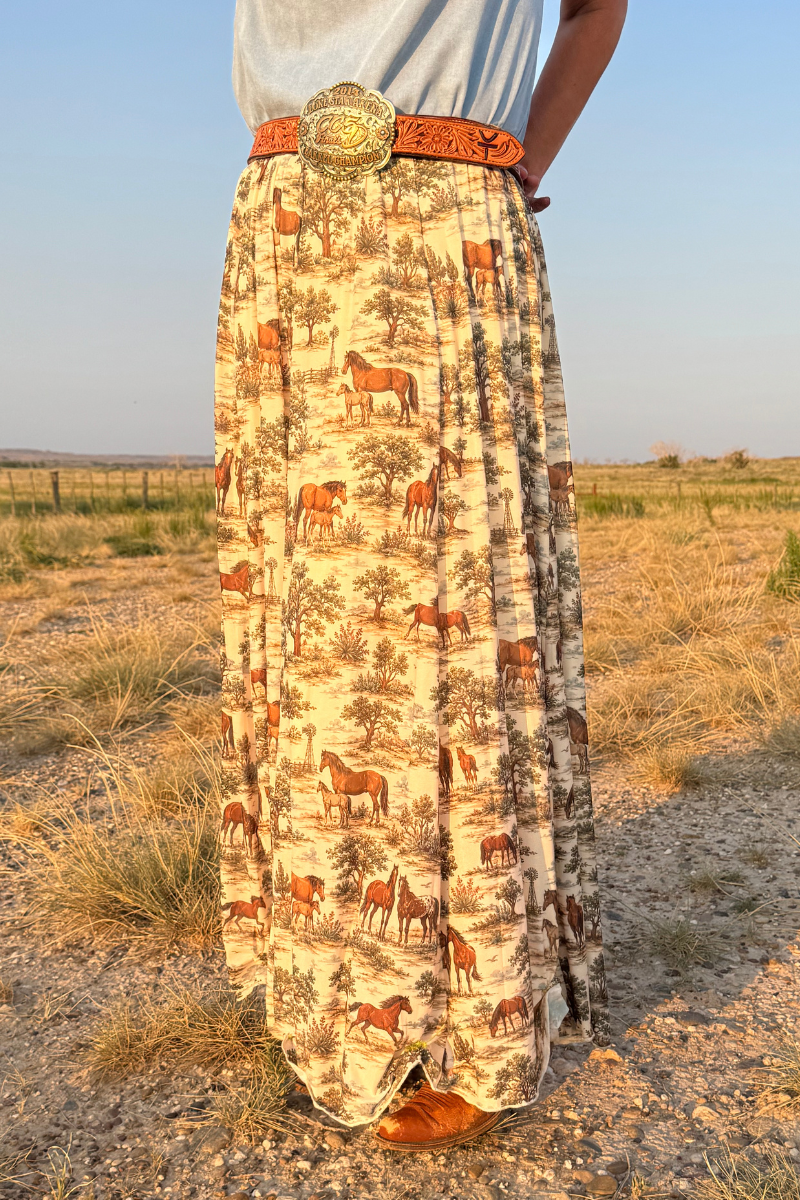 Tan maxi skirt with animal print, high waist belt and flowing floor-length hem