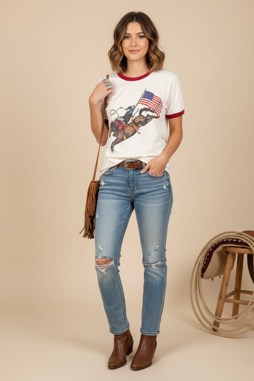White graphic T-shirt with bronc and American flag print, red collar and sleeve trim