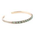 Turquoise and bronze cuff bracelet with oval stone inlays and rope-texture edges