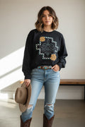 Black sweatshirt with checkered boot and gold-tooled flower graphic