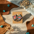 Serape-style diamond earrings with multicolor round stones and rhinestone halo