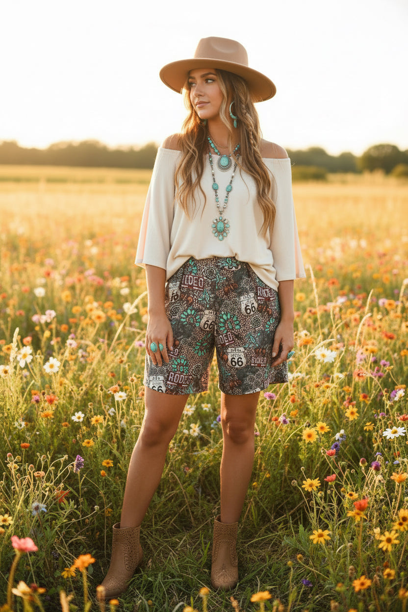 Dark patterned long shorts with graphic patches and side pockets